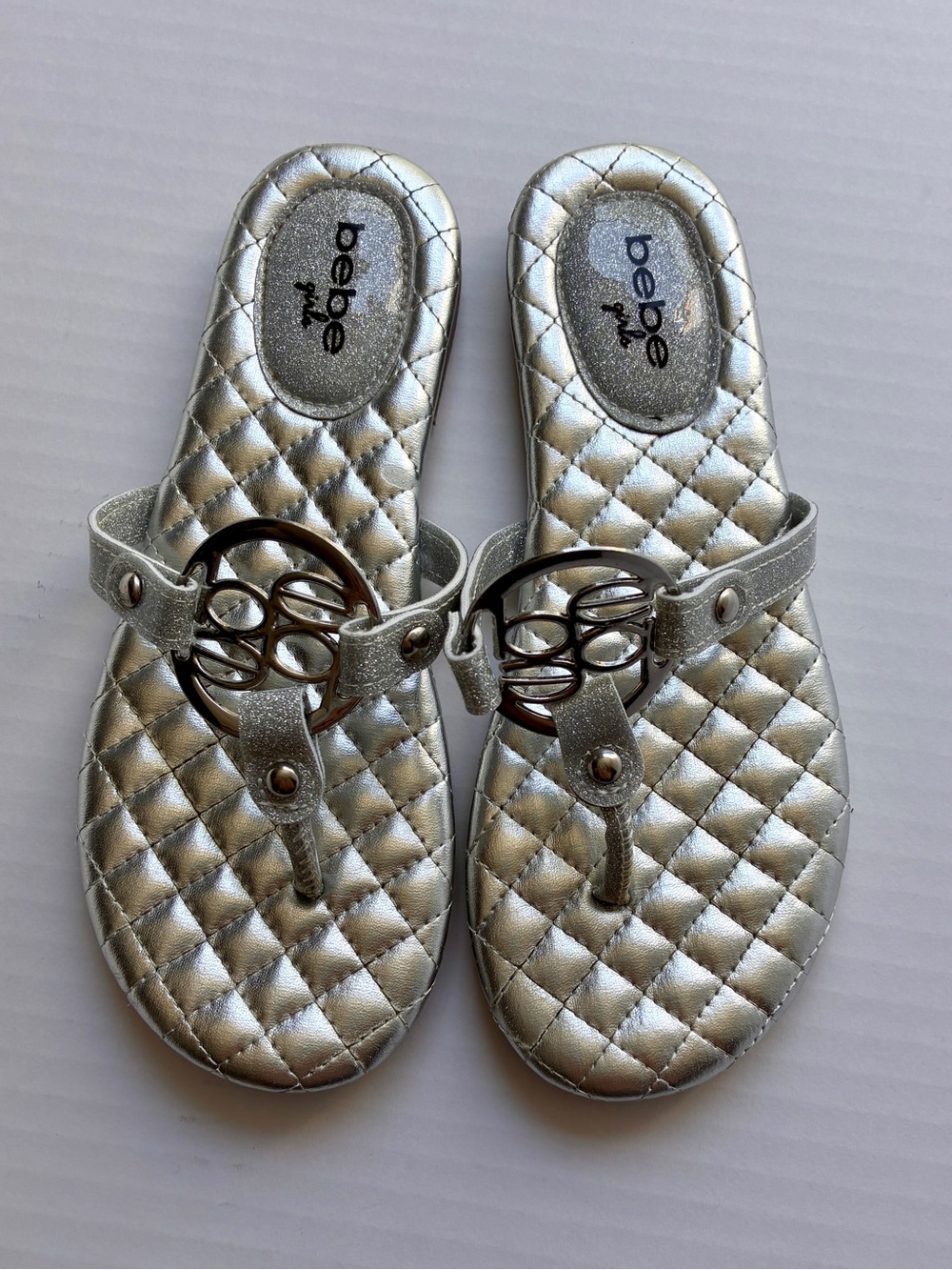 bebe Metallic Silver Quilted Thong Sandals with Logo Accent